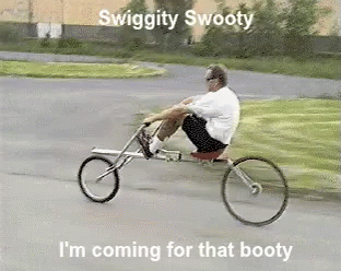 man riding a tiny bicycle with quote about swigglyy sweatyy