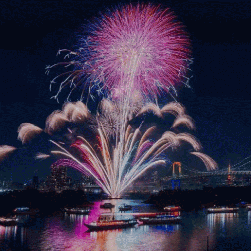 this is a fireworks show with boats in the water