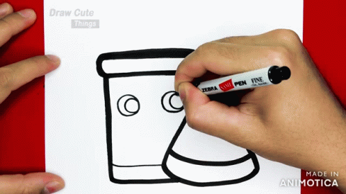 a person drawing a coffee cup on a paper
