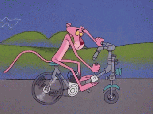 an animated man riding a bicycle on a roadway