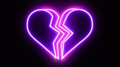 the neon sign is made up of a broken heart