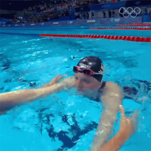 a swimmer swimming in the water at a sporting event