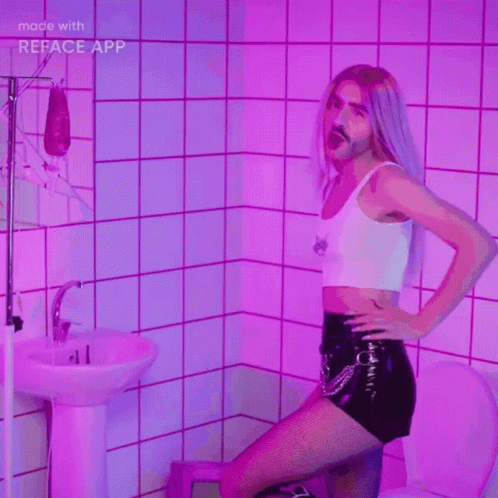 the girl is posing on the stool next to the bathtub