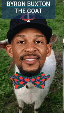 a man is wearing a hat and a bow tie