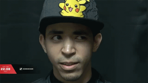 a man that is wearing a cap with a pikachu on it