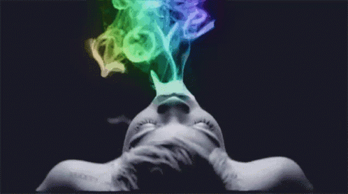 a multicolored smoke coming from the face of a human