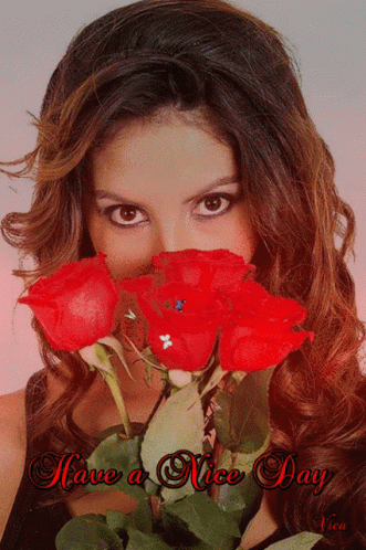 a woman that is posing with some roses