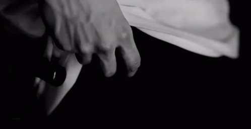 two hands holding each other in black and white