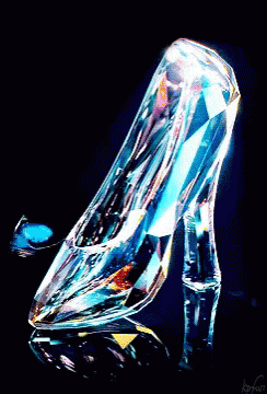 a glass shoe that is sitting on a counter