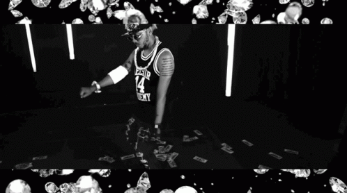 a group of two pictures of a person on a stage surrounded by silver balls
