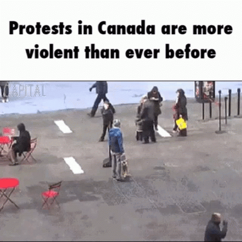 a group of people standing around each other near a sign that says protests in canada are more violent than ever before