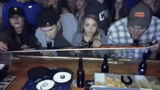 group of people sitting next to each other at a party