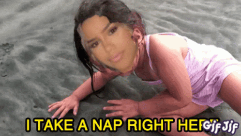 a woman laying on her side in the sand with a caption that says take nap right off the sand