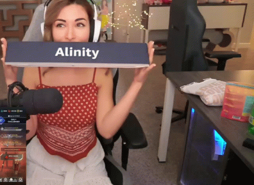 a girl holding a sign with the word'alinity '