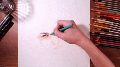 a person is drawing with colored pencils and a yellow marker