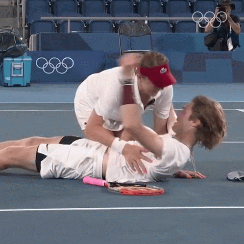 a tennis player is shown being injured by an umpire