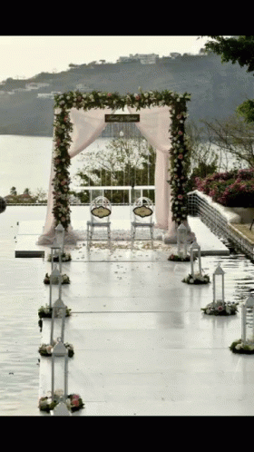 chairs are set up for a wedding with a lake in the background