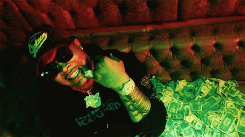 a man eating in front of a table filled with money