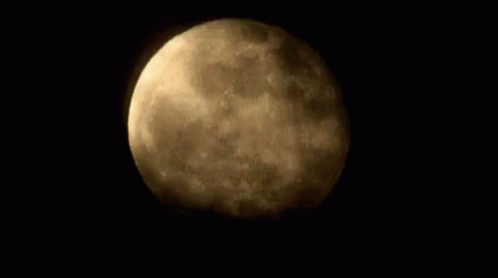 the full moon seen from space in black background