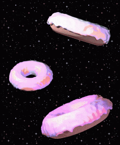 three donuts in the middle of a black background