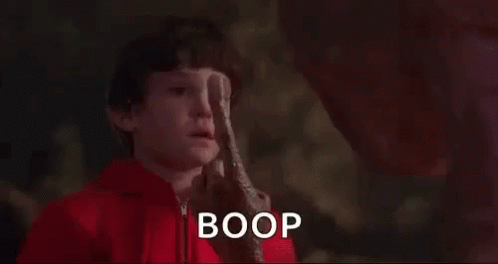 the words boop are in front of a po of a child with brown hair and a white top