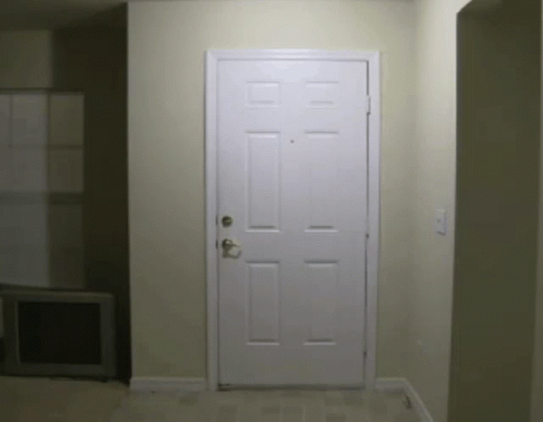 a large room with a white door in it