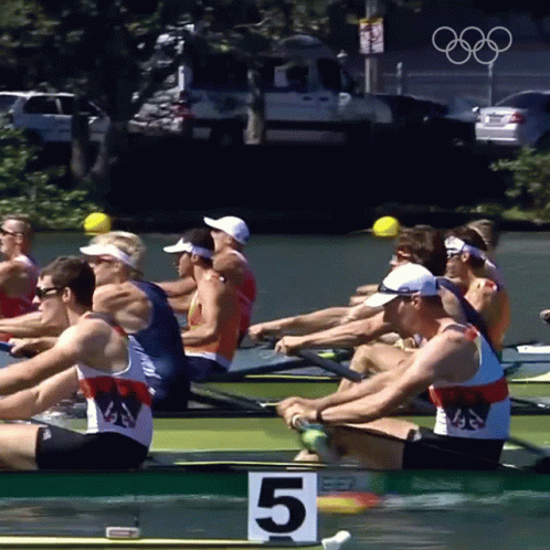 a group of rowers sitting down in the water