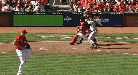 a baseball player with a bat in his hands is throwing the ball at home plate