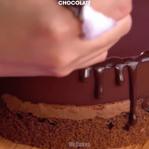 the inside of a chocolate cake has drizzled on the top