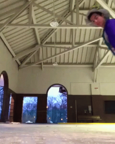 a skateboarder does an aerial maneuver on a ramp
