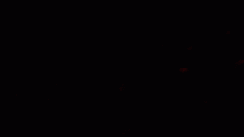a black po of a traffic light at night