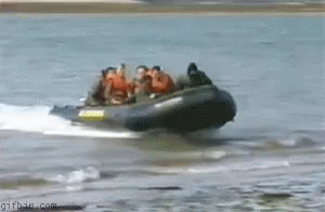 a group of people ride in a raft down a river