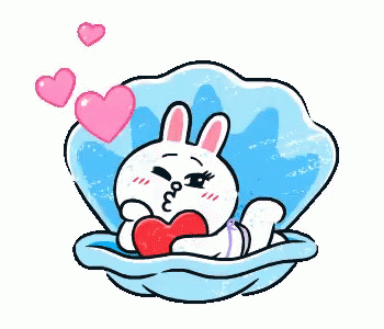a cute bunny sitting in a nest with hearts