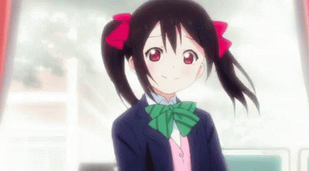 anime image of an animated girl with dark hair wearing a purple top and green bow tie