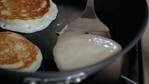 an image of blue and white pancakes cooking