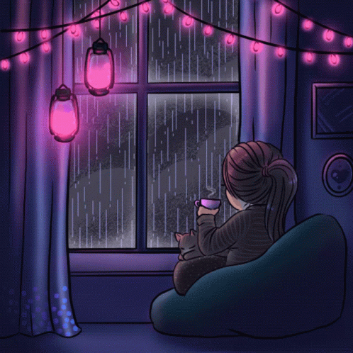 woman sitting in chair and looking out window with rain