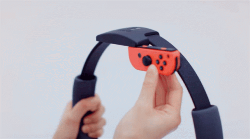 a hand holds a game controller in it's hands