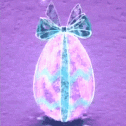 there is an egg with a bow that is pink and yellow