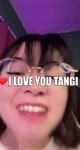 a girl wearing glasses with the words i love you tangi above her