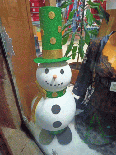 a snowman made with green and black fabric