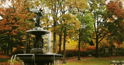 there is an artistic image of a fountain in the park