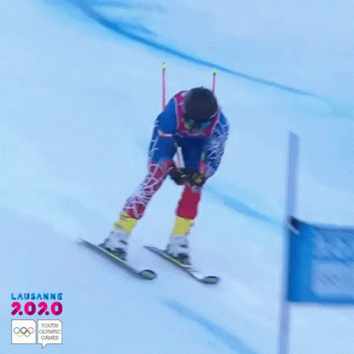 a skier is bending on his skis at the starting line
