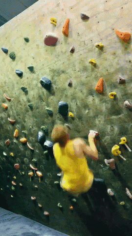this is someone climbing on a climbing wall