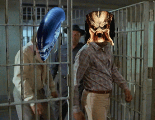 a man in a creepy mask in front of prison cell