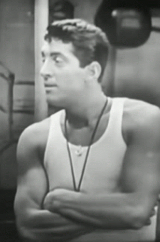 this is an image of a young man wearing a tank top