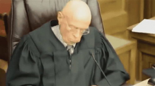 an image of a judge in court doing a read