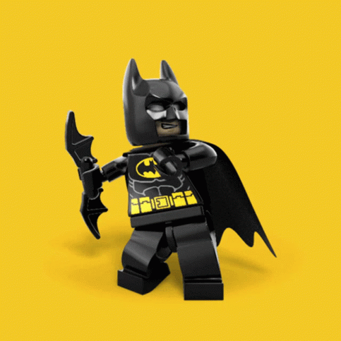 a lego batman with bat on his hand