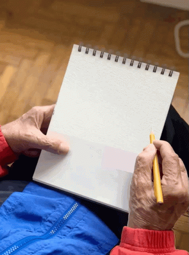 an older person dressed as a doctor with a notepad