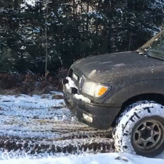 an off road truck on a muddy road