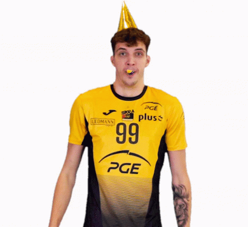 a young man wearing a shirt with a birthday hat